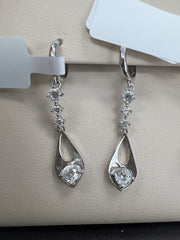 White gold long hanging earrings with stones