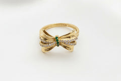 14k ring bow with green stones