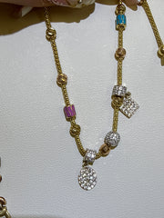 14k color blue and pink stone bracelet hanging