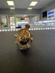 14k turtle ring with white and pink stones. Turtle inside