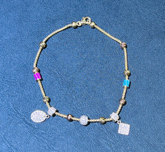 14k color blue and pink stone bracelet hanging