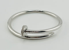 Silver bangle clavo nail
