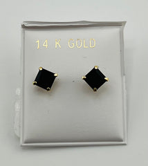 Baby earing small black stone