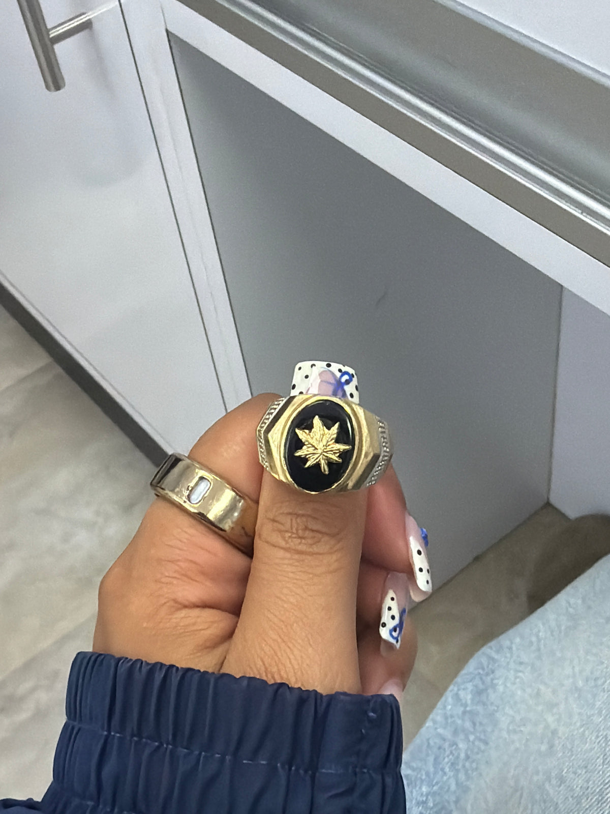 14k mens ring with black enamel and leaf symbol