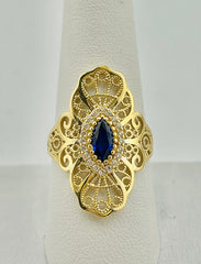 14k swirly ring with blue stone