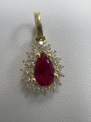 10k pear shape red stone pendant with white stones