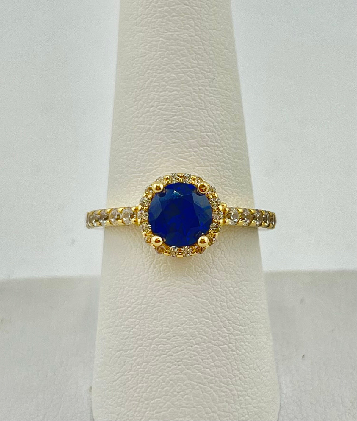 14k circle ring with big dark blue stone