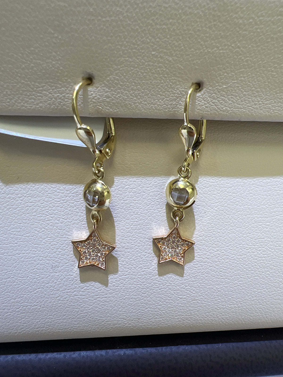 14k Two tone hanging earrings with star and stone