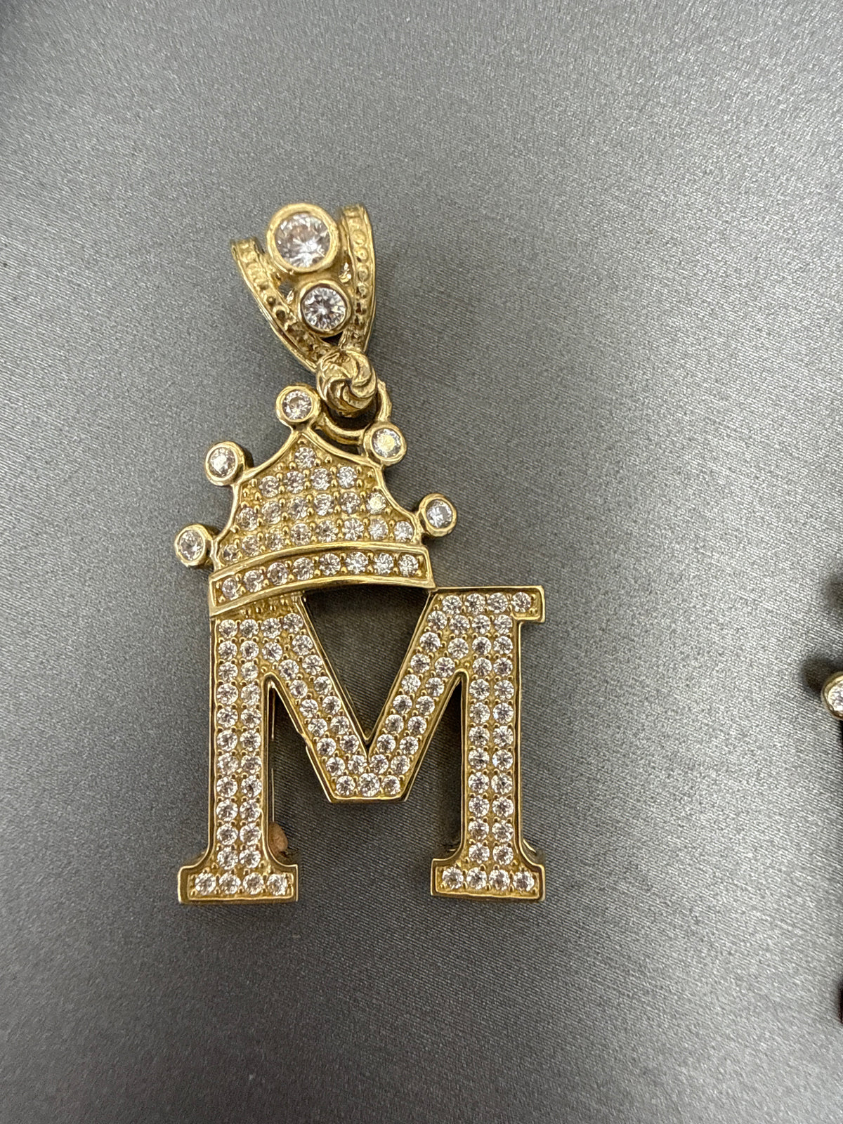 14k letter K pendant with crown on Cz’s stones