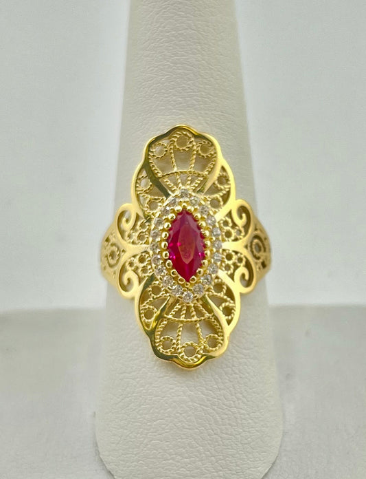 14k swirly ring with red stone