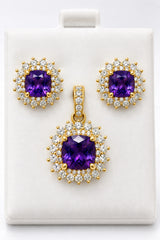 14k Earring and pendant in purple gems set in a floral-inspired sunburst halo design consisting of an inner ring of smaller round accents and an outer scalloped border of marquise-shaped