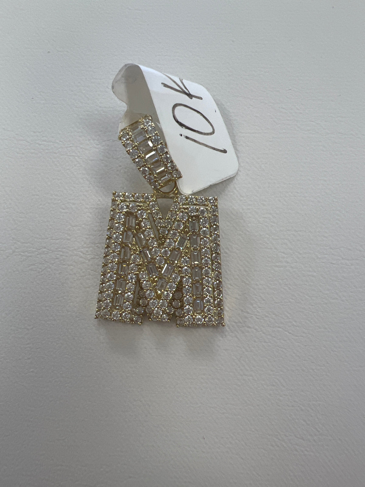 10k letter M pendant with Cz’s stones