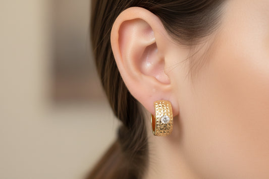 14k earings huggies with center stone