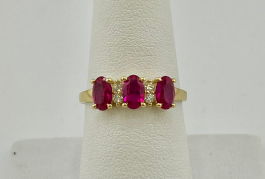 14k ring with three red stones