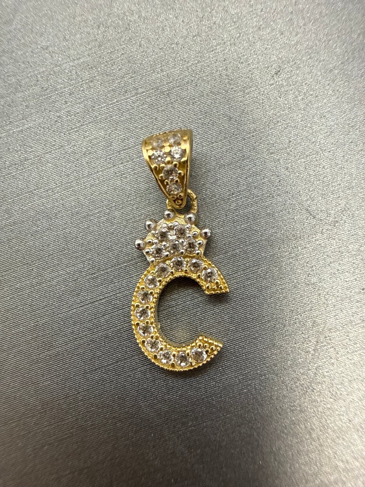 14k letter C pendant with crown and CZ’s stones 1.02