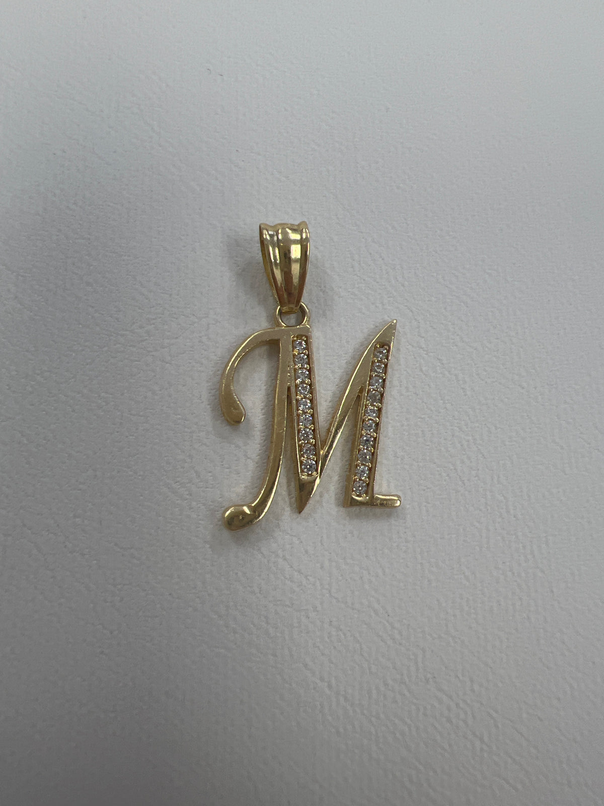 14k letter M pendant with Cz’s stones