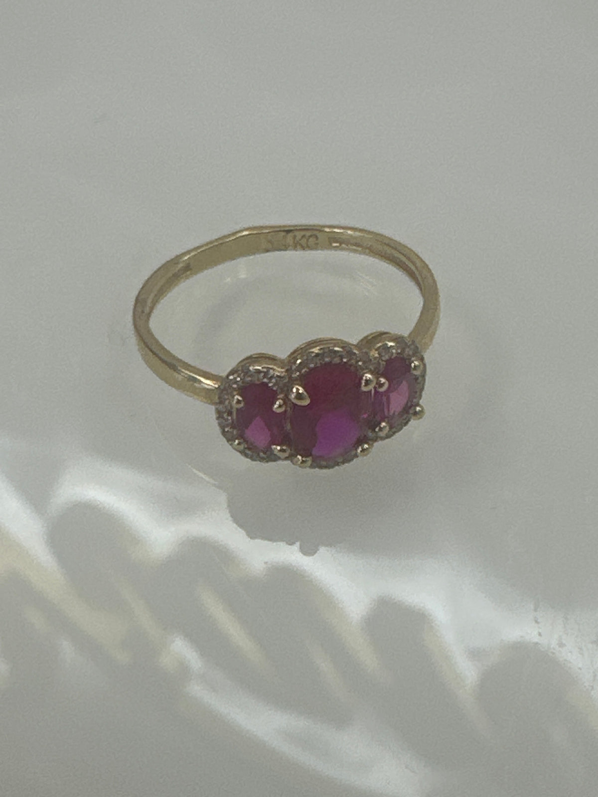 14k ring  3 red stone with hallo stones