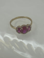 14k ring  3 red stone with hallo stones