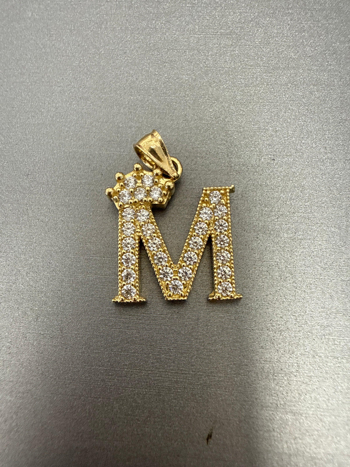 14k letter M pendant with crown on Cz’s stones 2.74g