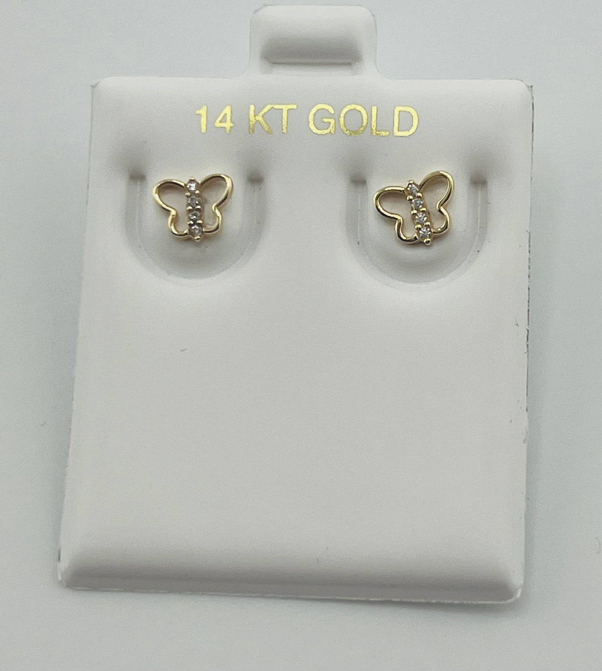 Baby earing butterfly with stones