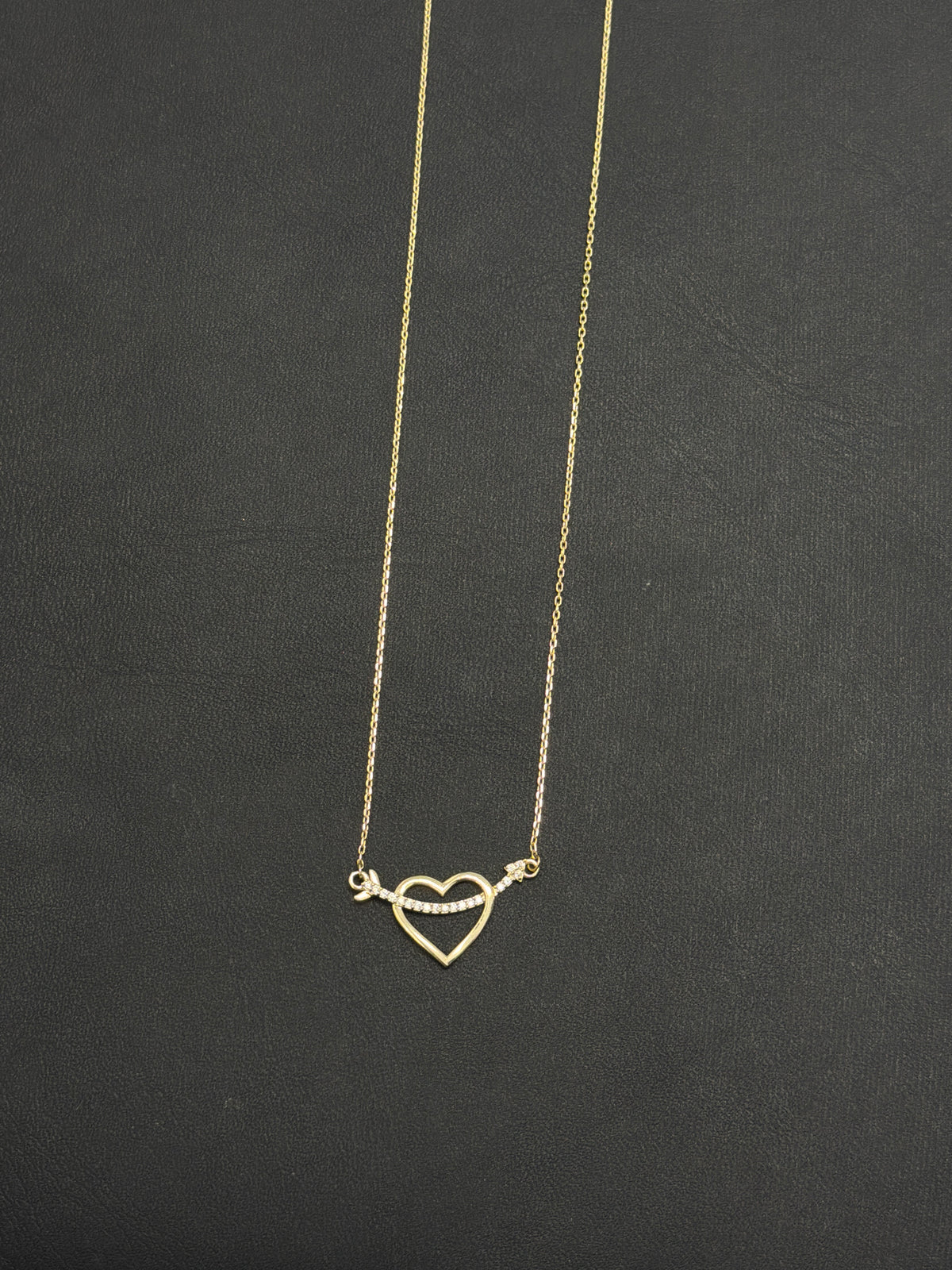 14k Heart necklace with arrow going through