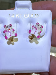 Baby earing blue stone