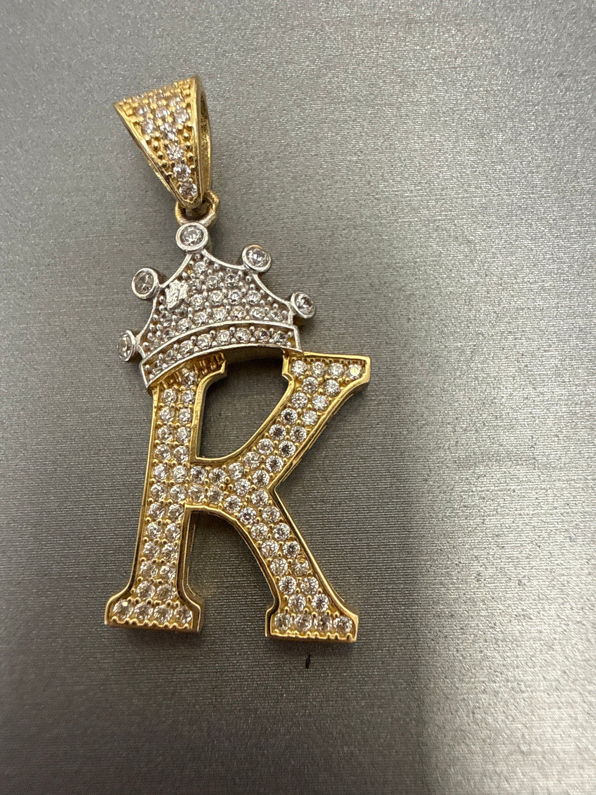 14k letter K pendant with crown on Cz’s stones