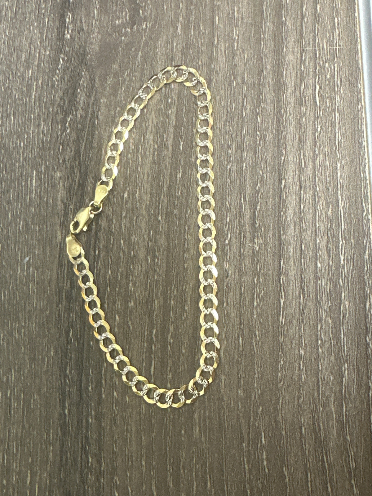 10k bracelet cuban diamond cut.
