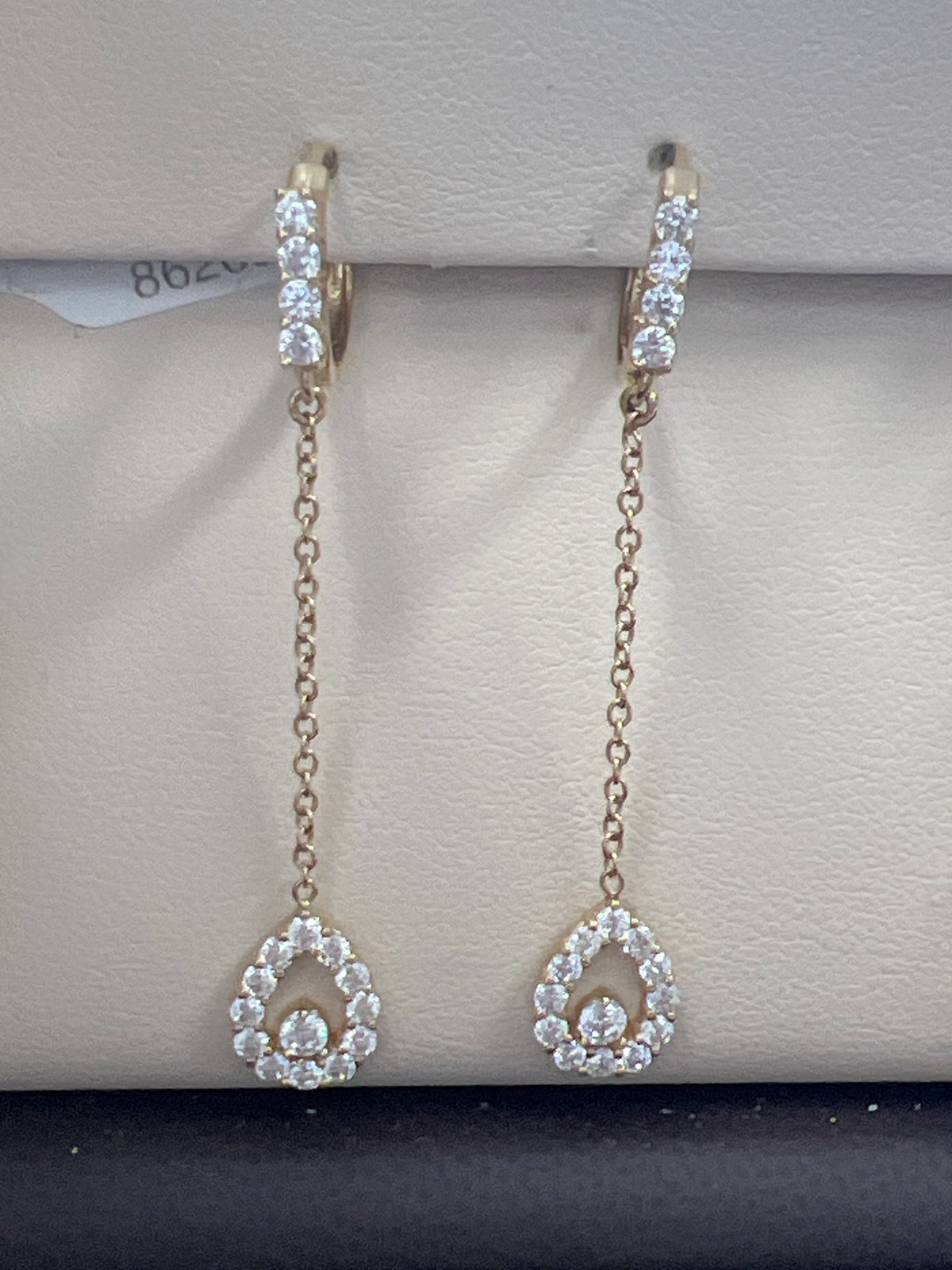 14k oval hanging earrings with many stones