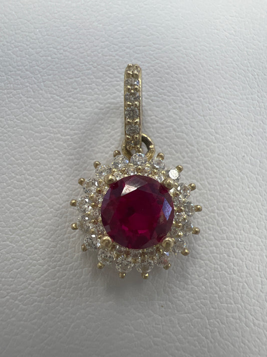 10k circle red stone pendant with white stones