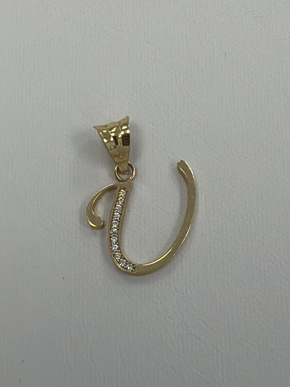 14k letter U pendant with Cz’s stones