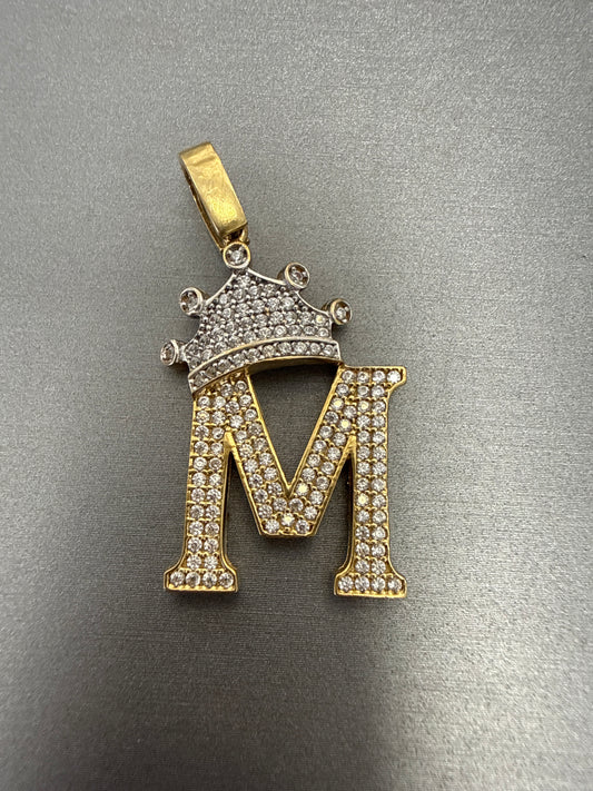 14k letter M pendant with crown on Cz’s stones white gold on crown