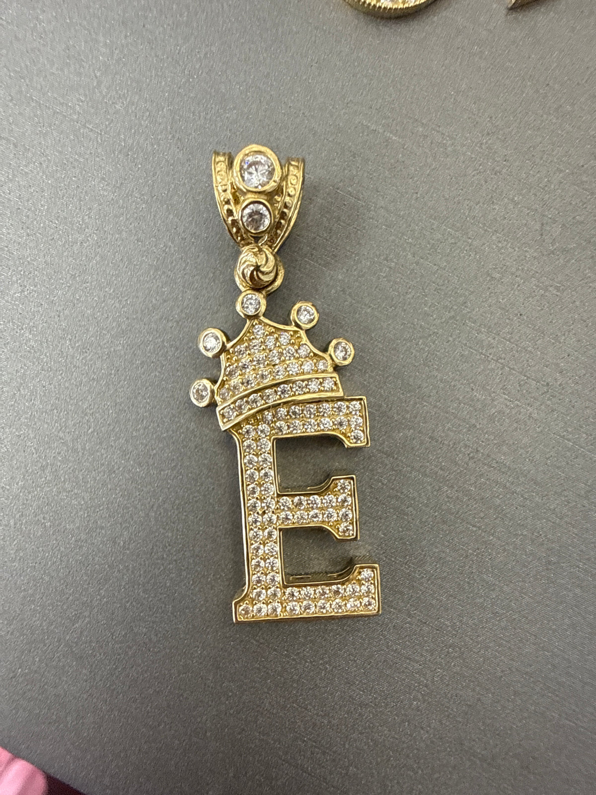 14k letter E pendant with crown on Cz’s stones