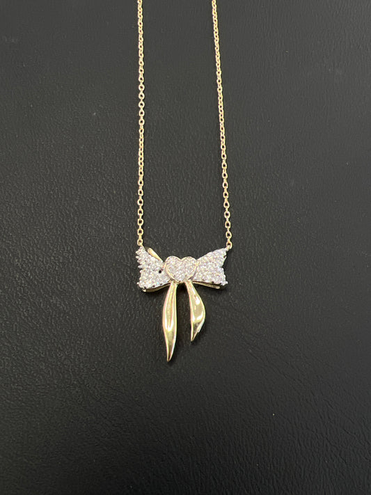10kt gold bow necklace with .25ct diamond