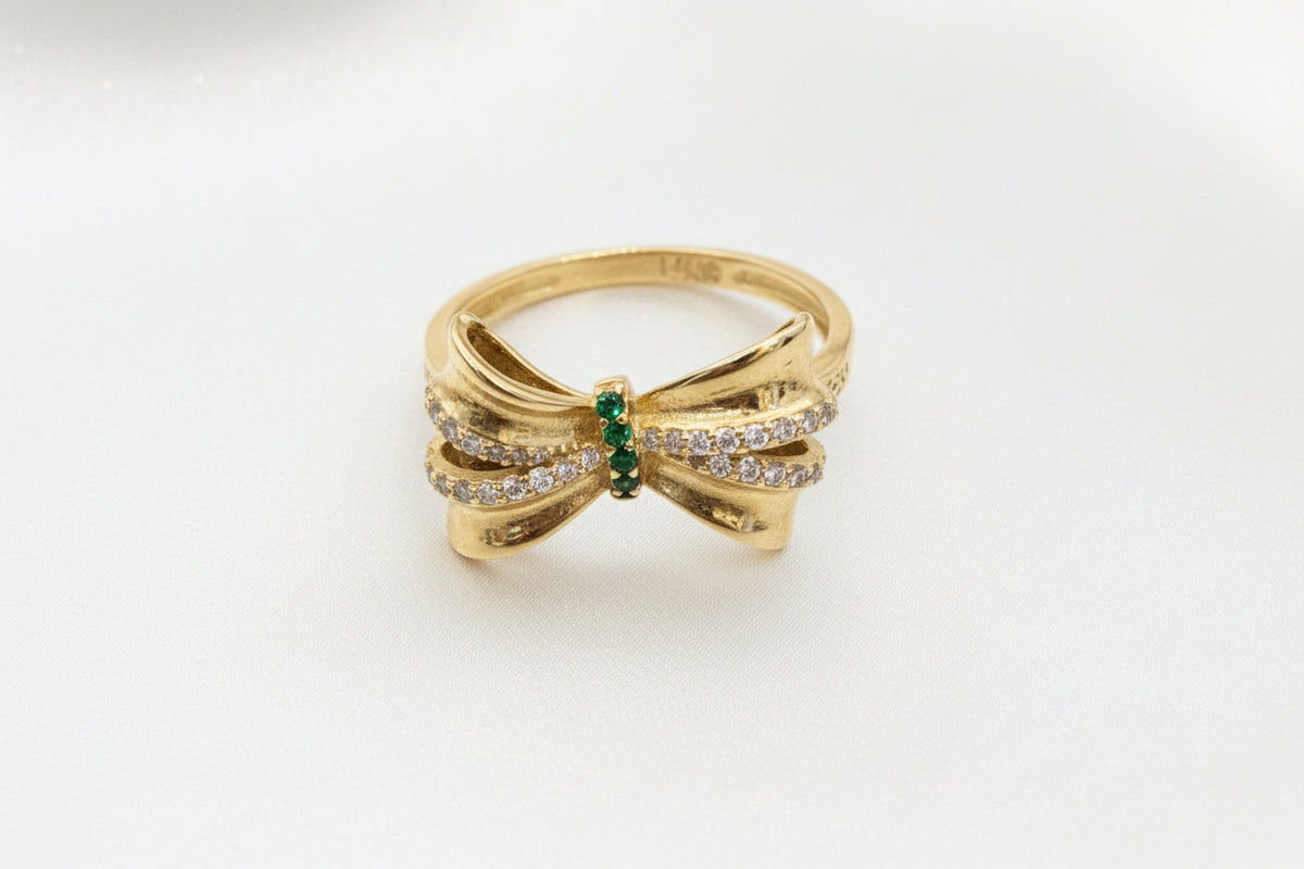 14k ring bow with green stones