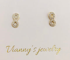 Baby earing infinity with stones
