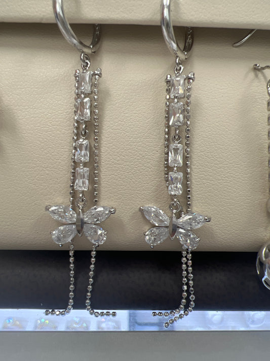 White gold long hanging earrings with butterfly and many stones