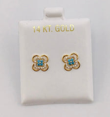 Baby earing blue and white