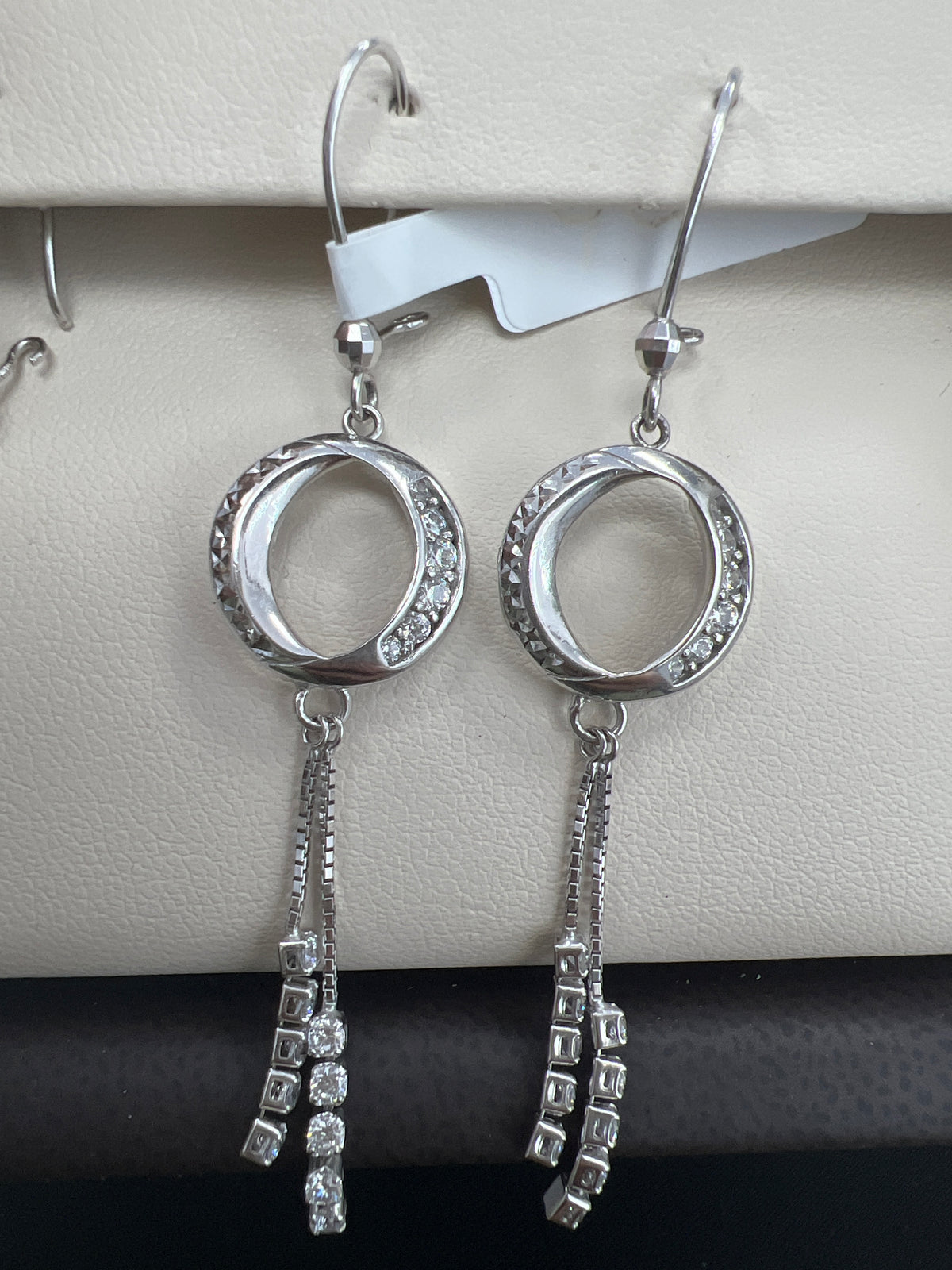 White gold long hanging earrings with circle and stones