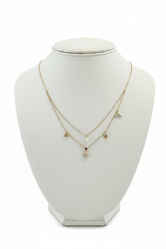 14k gold beach inspired necklace with .16ct diamond ruby, starfish pearl whale tale, clam, jellyfish