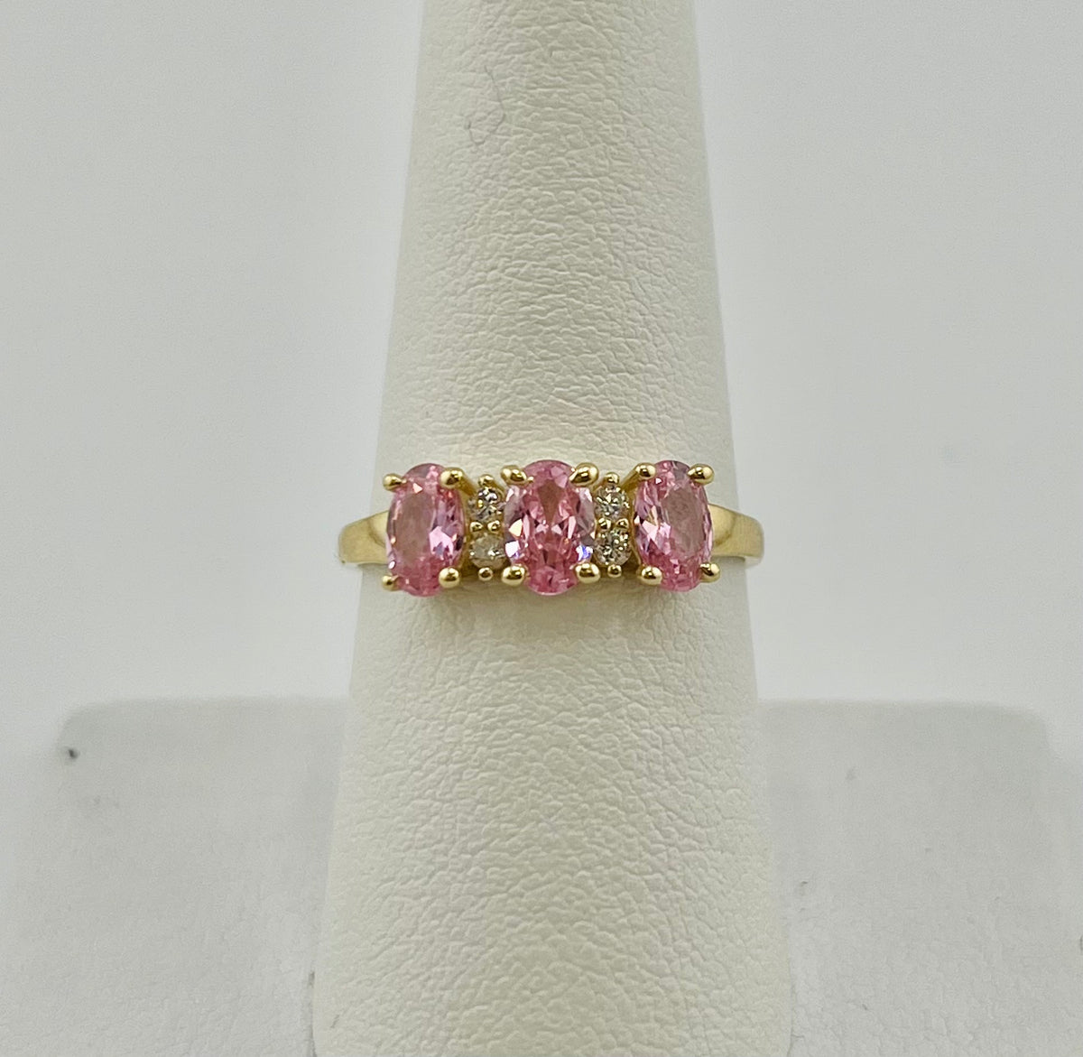 14k ring with three pink stones