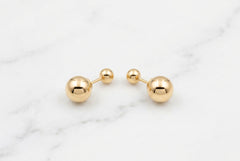 10k ladies earring with balls in front and back of different size