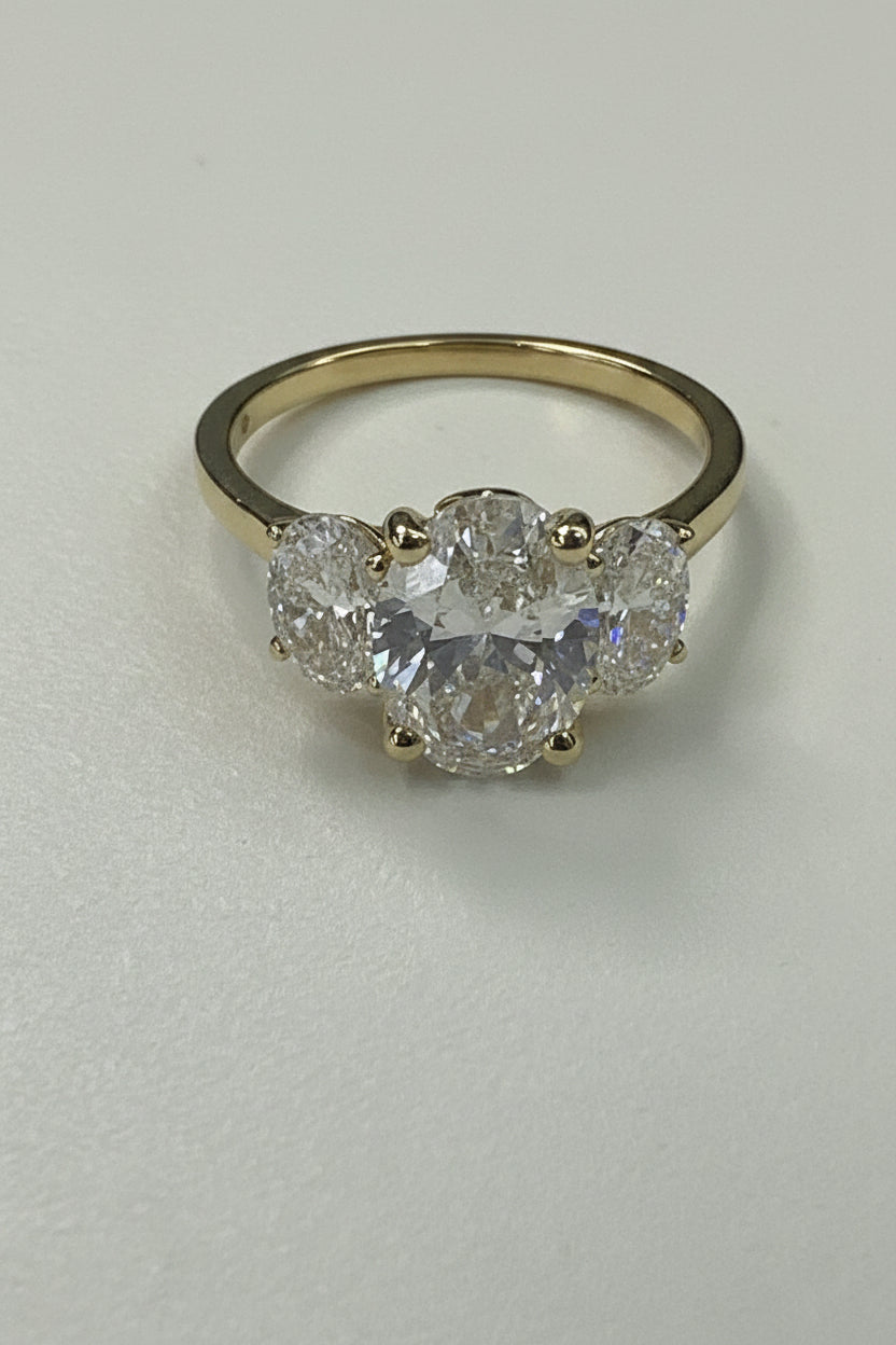 14k  Diamond Engagement oval with 3 lab grown diamonds  with a total estimated weight of 3.20CT with certificate