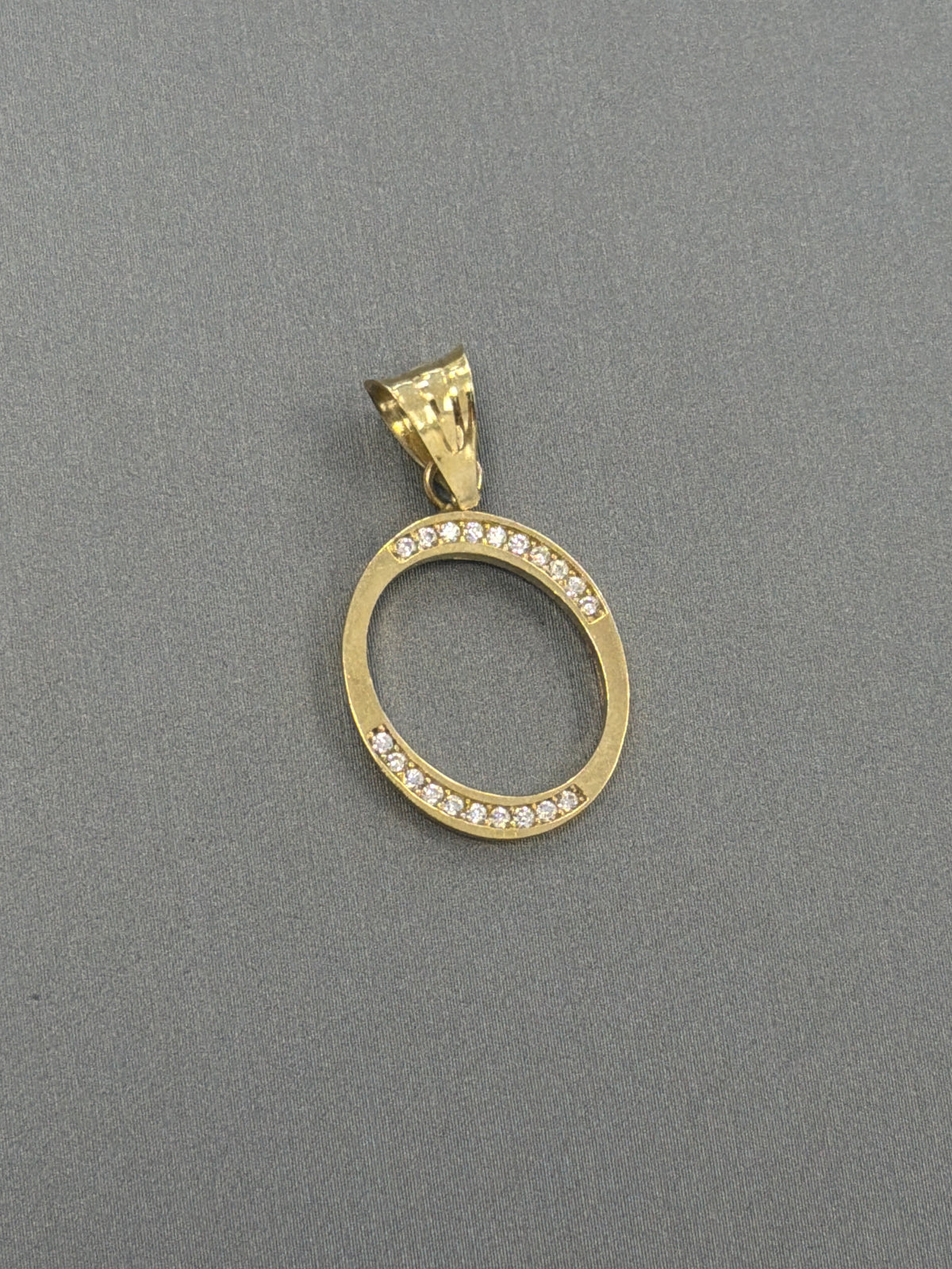 14k letter O pendant with Cz’s stones