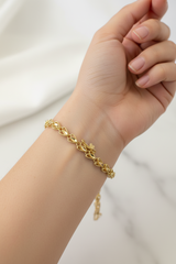 14k heart bracelet solid gold with diamond cut hearts.