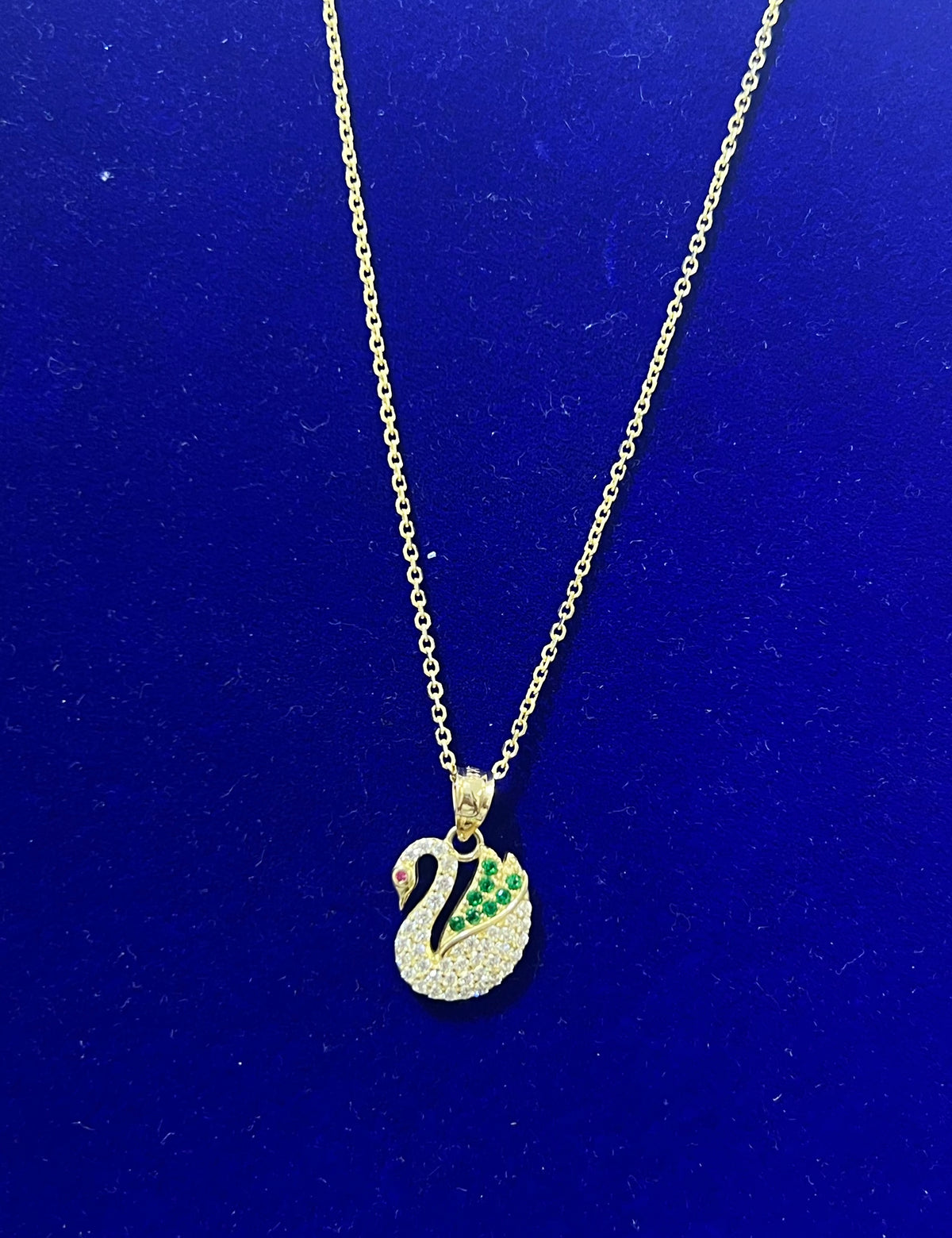 14k necklace 16” with green and white (stones) swan pendant