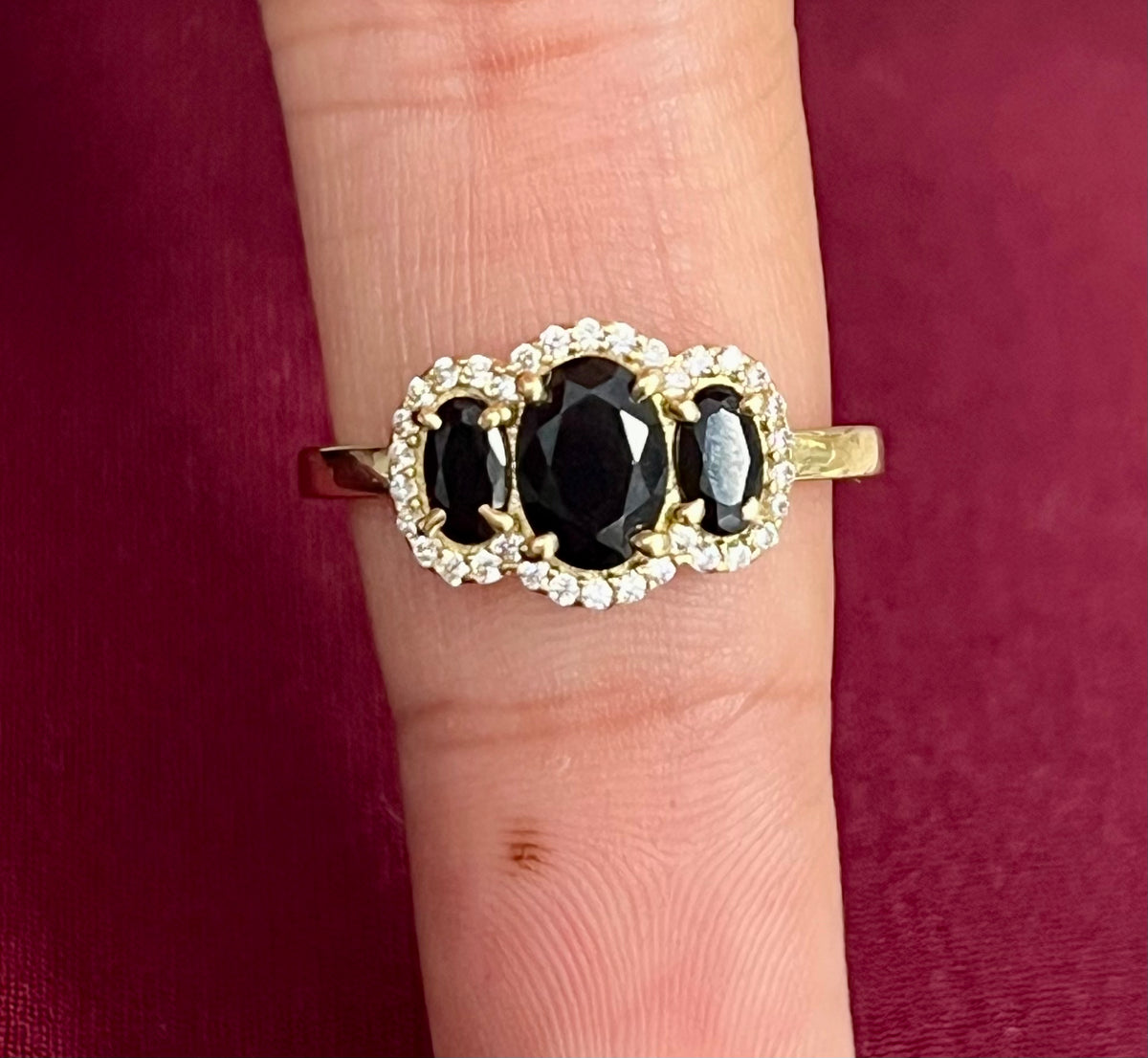 14k 3 black stone ring with 3 stones and halo