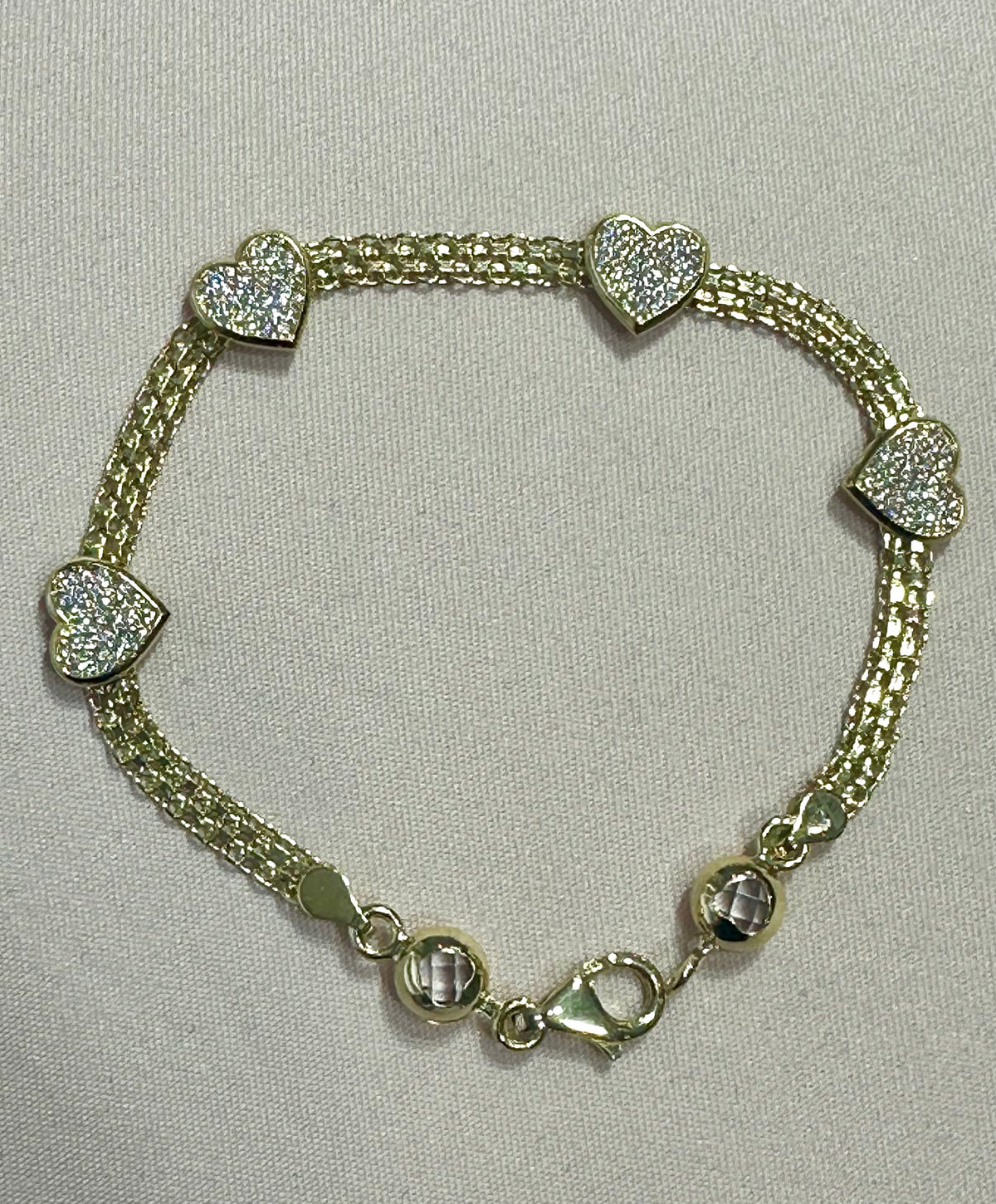 14k heart bracelet with stones 7”