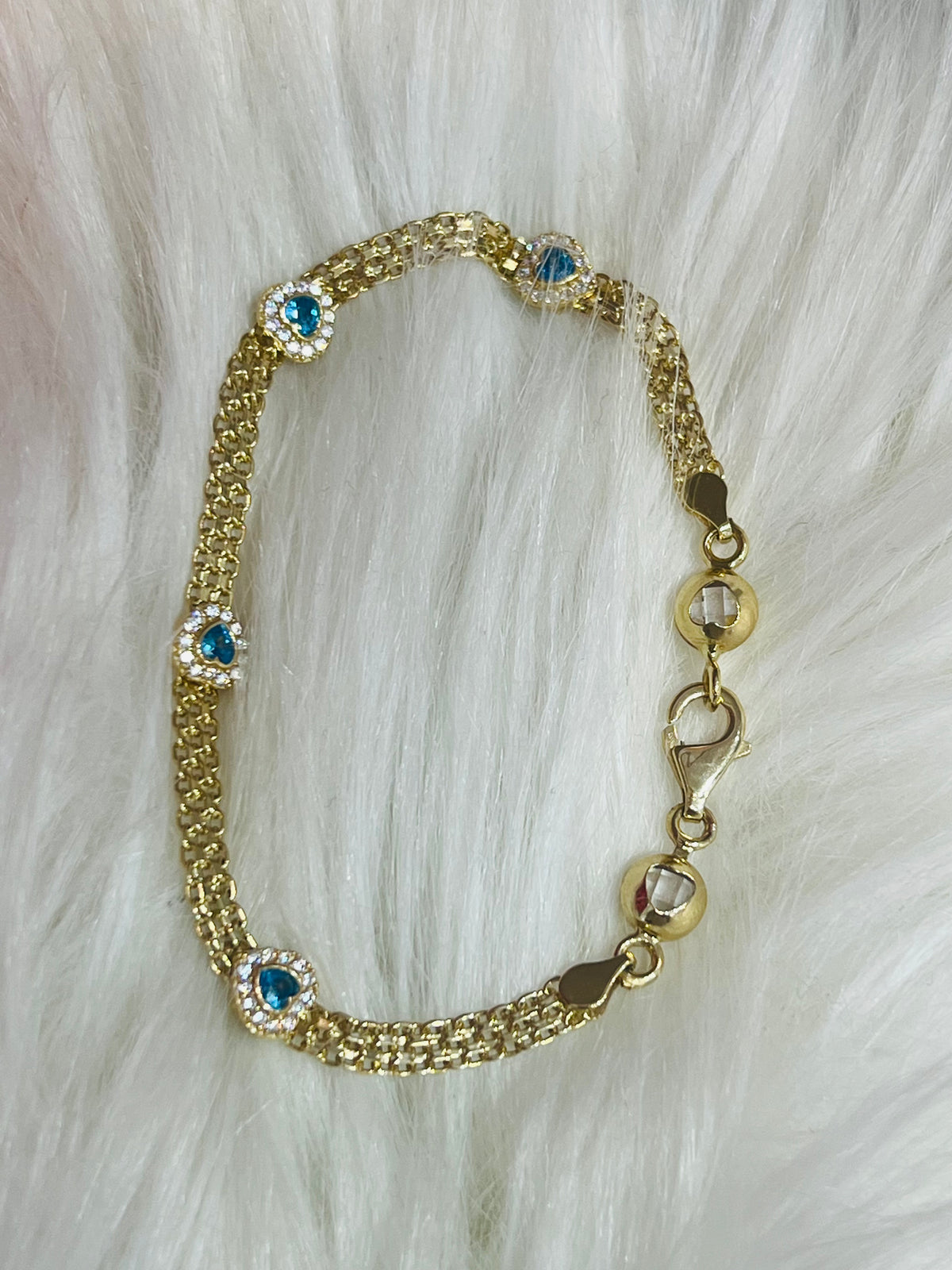 14k gold bracelet with blue stone hearts