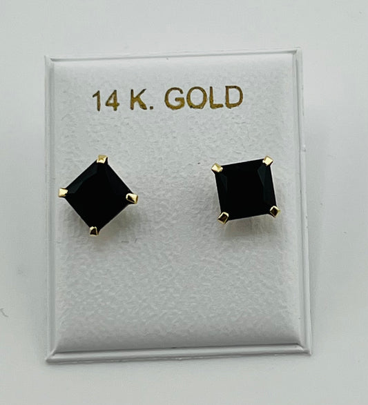Baby earing black stone